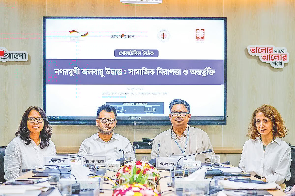 Discussants at a roundtable on climate refugees pose for a photograph on 29 June