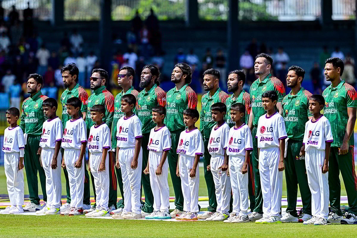 Bangladesh's players stand for their national anthem before the start of the first one-day international (ODI) cricket match between Sri Lanka and Bangladesh at the R. Premadasa International Cricket Stadium in Colombo on July 2, 2025