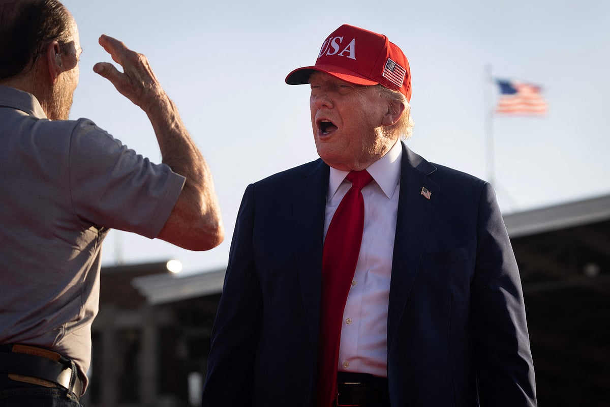 Lee Greenwood salutes as President Donald Trump arrives at a rally to kick off the July Fourth holiday weekend at the Iowa State Fairgrounds on July 03, 2025 in Des Moines, Iowa