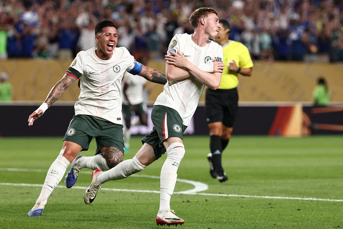 Chelsea's English midfielder #10 Cole Palmer (R) celebrates with teammate Argentinian midfielder #08 Enzo Fernandez (L) after scoring his team's first goal during the FIFA Club World Cup 2025 quarterfinal football match between Brazil's Palmeiras and England's Chelsea at the Lincoln Financial Field Stadium in Philadelphia on 4 July, 2025.