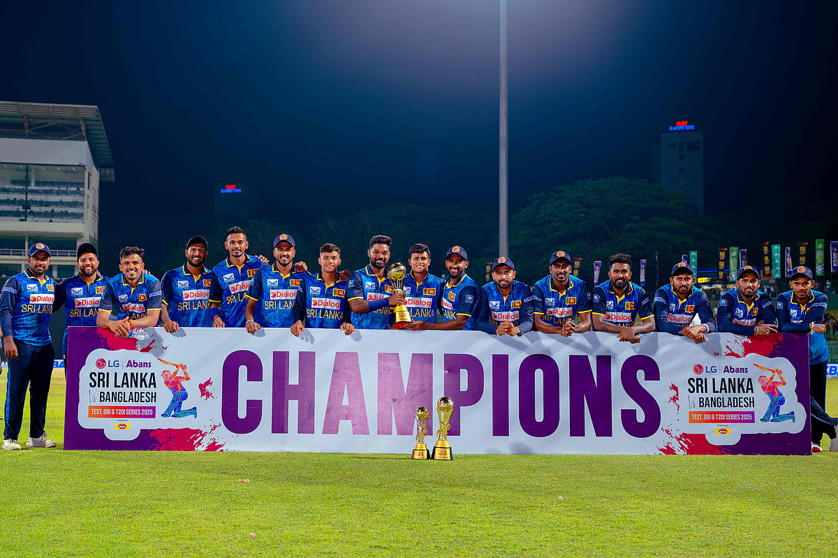 Sri Lanka’s players pose with the trophy after winning the third and final one-day international (ODI) cricket match between Sri Lanka and Bangladesh at the Pallekele International Cricket Stadium in Kandy on 8 July 2025