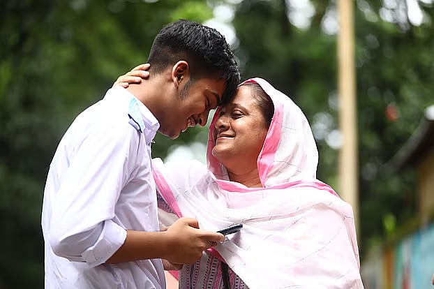 A mother overcome with emotion as her son's SSC exam are published. Thursday, at Blue-Bird School and College, Sylhet
