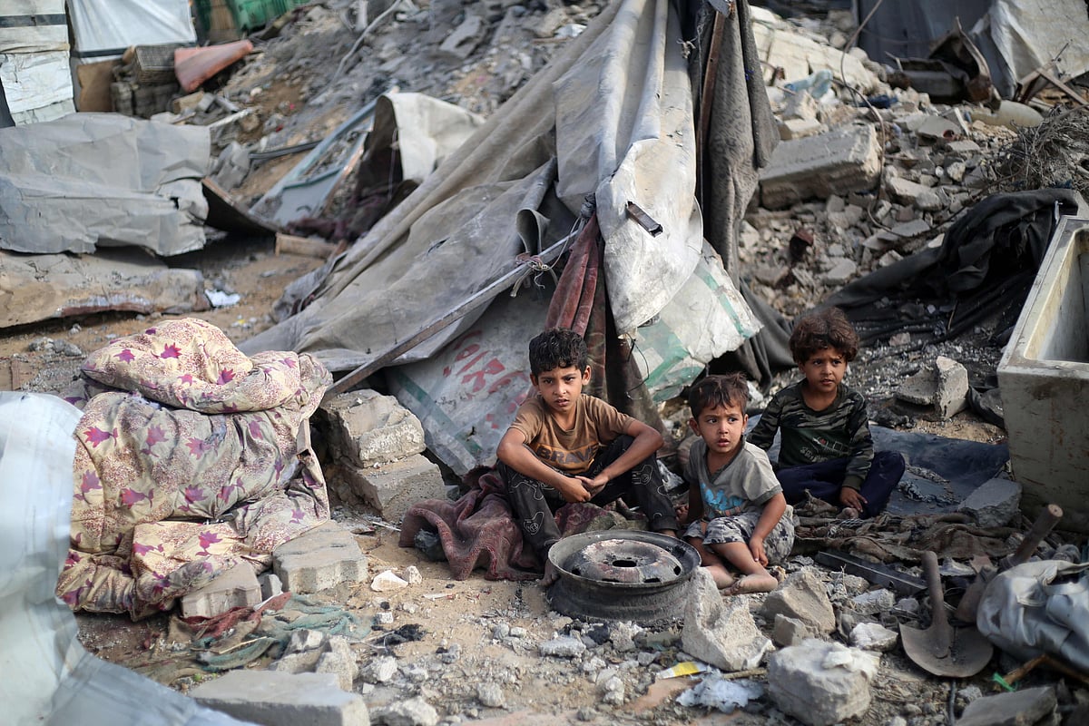 A Palestinian boy stands amid the destruction in the aftermath of an Israeli strike in the Bureij refugee camp in the central Gaza Strip on 10  July, 2025.