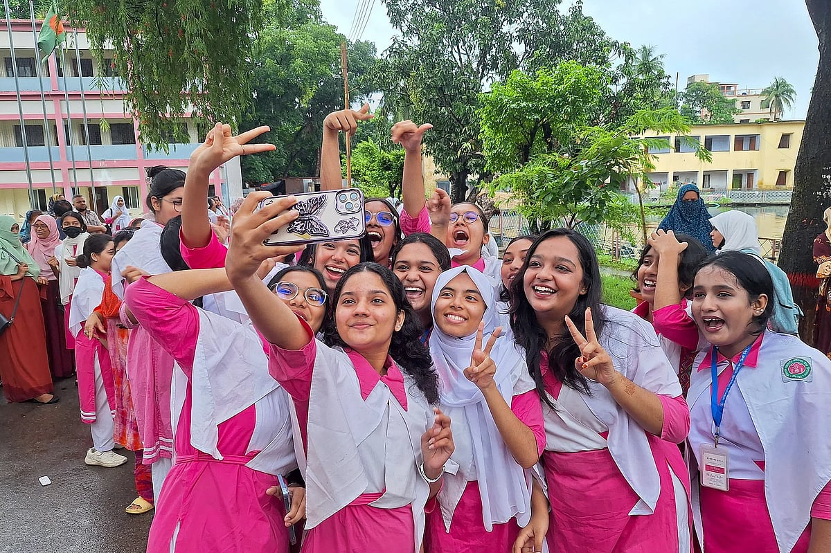 Students celebrate by taking photos after getting their desired results in the SSC exams. This phot was taken at the Government Girls' High School in Barishal on 10 July.