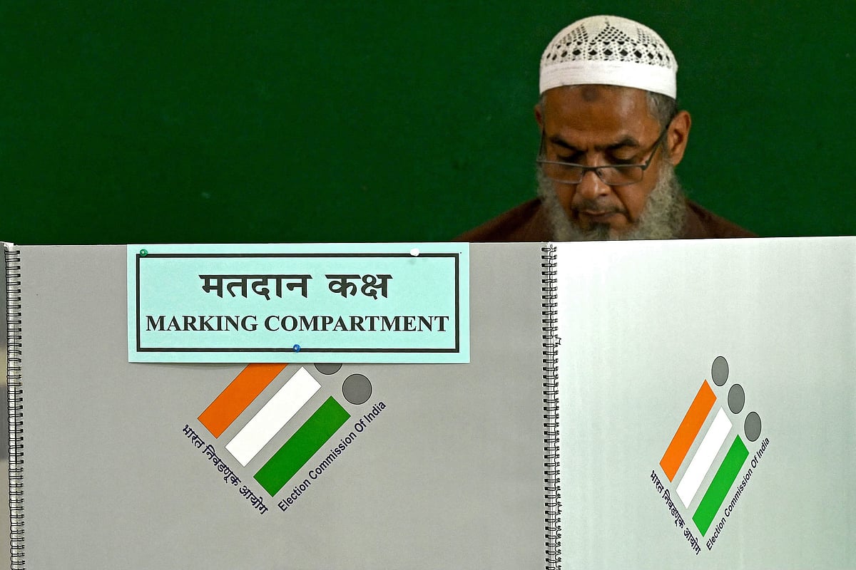 A voter casts his ballot during the fifth phase of voting for India's general election, at a polling station in Mumbai on 20 May, 2024. Indian election officials have given voters in the state of Bihar just weeks to prove their citizenship, requiring documents few possess in a registration revamp set to be applied nationwide, triggering disenfranchisement fears.