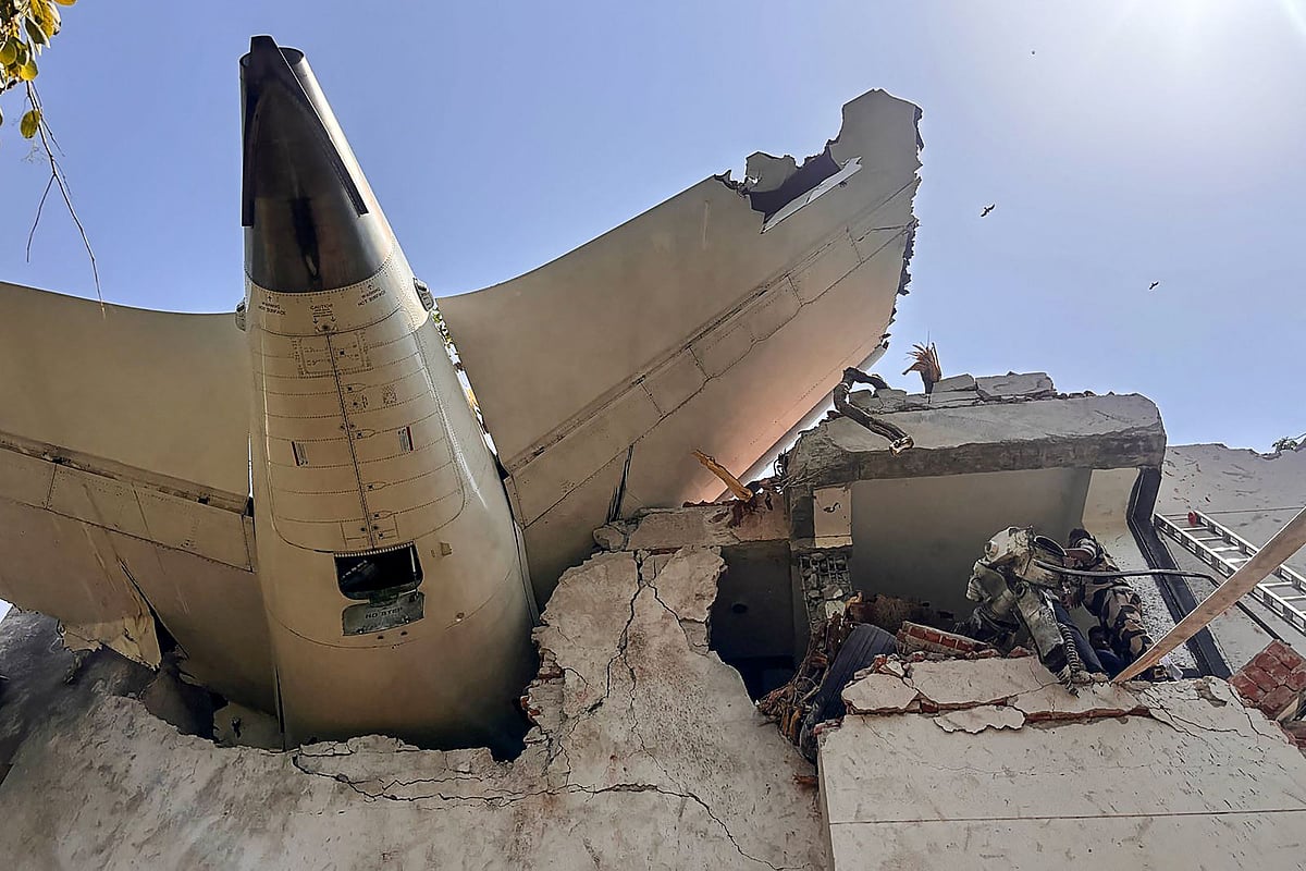 This handout photograph taken and posted on the X (formerly Twitter) account of the Central Industrial Security Force (CISF) on 12 June, 2025 shows the tailpiece of Air India flight AI171 after it crashed in a residential area near the airport in Ahmedabad