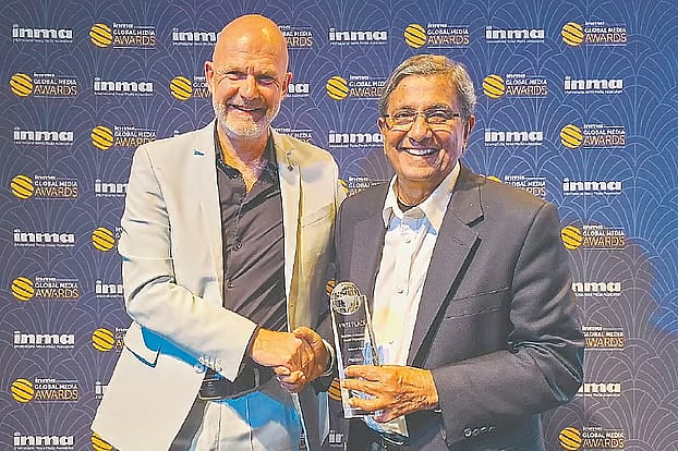 Prothom Alo editor Matiur Rahman receiving the award from the INMA president Gert Ysebaert