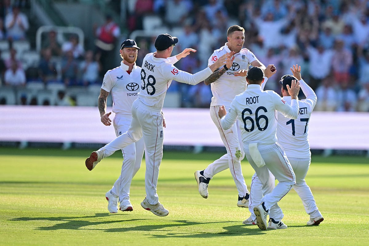 England's Brydon Carse (C) celebrates with teammates after trapping India's captain Shubman Gill LBW (leg before wicket) on the fourth day of the third cricket test match between England and India at Lord's cricket ground in London, on July 13, 2025