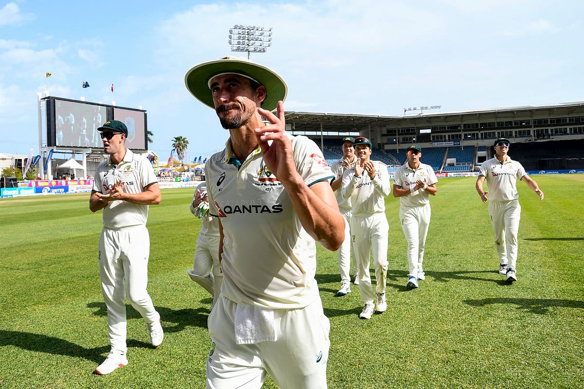 Mitchell Starc (2L) of Australia walks off the field waving to supporters during the third day of the third Test cricket match between West Indies and Australia at Sabina Park in Kingston, Jamaica, on 14 July 2025