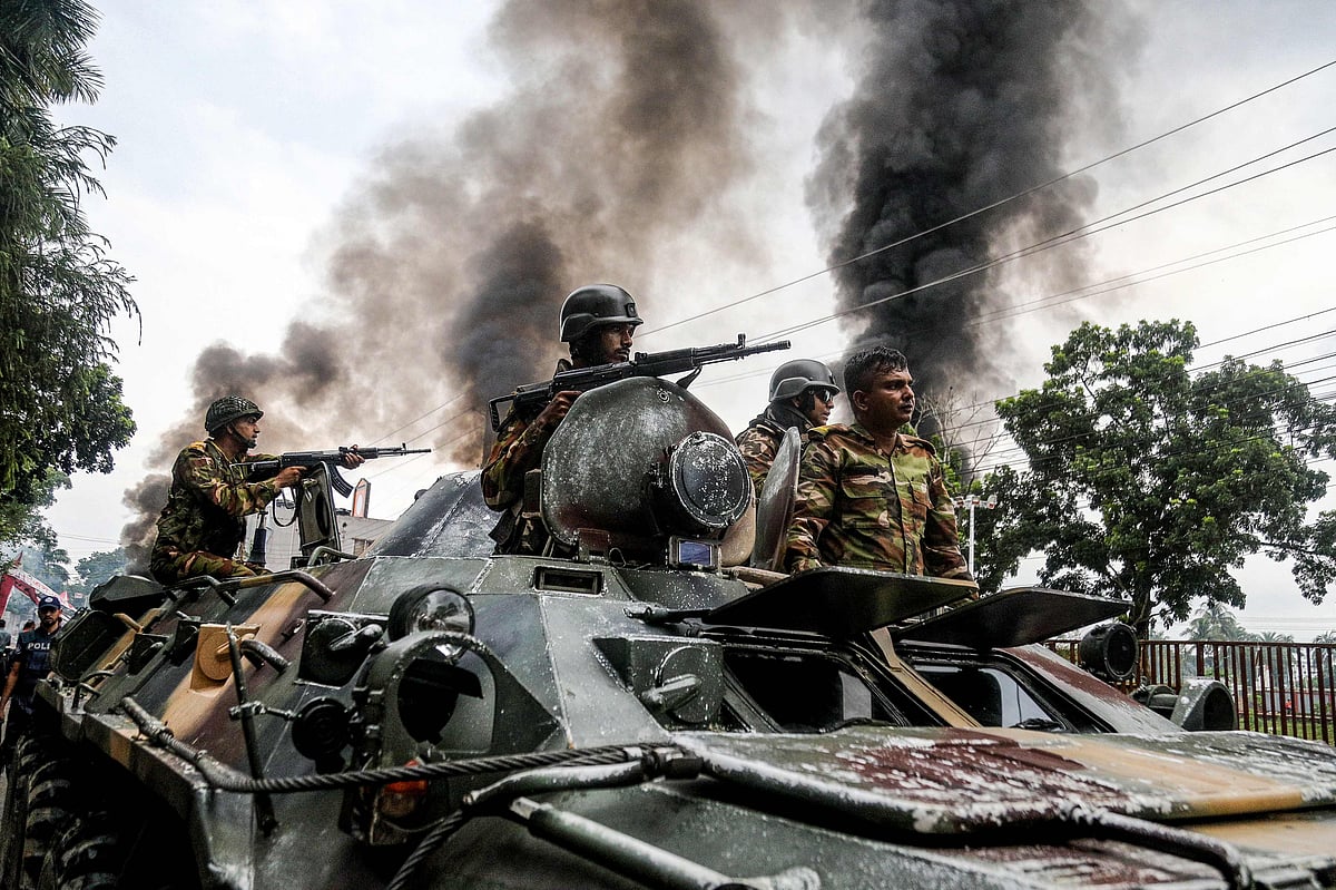 Army personnel patrol a street on an armoured vehicle after Awami League party activists allegedly clashed with security personnel to rebuke a rally by the newly formed Jatiya Nagarik Party, or National Citizen Party in Gopalganj on July 16, 2025