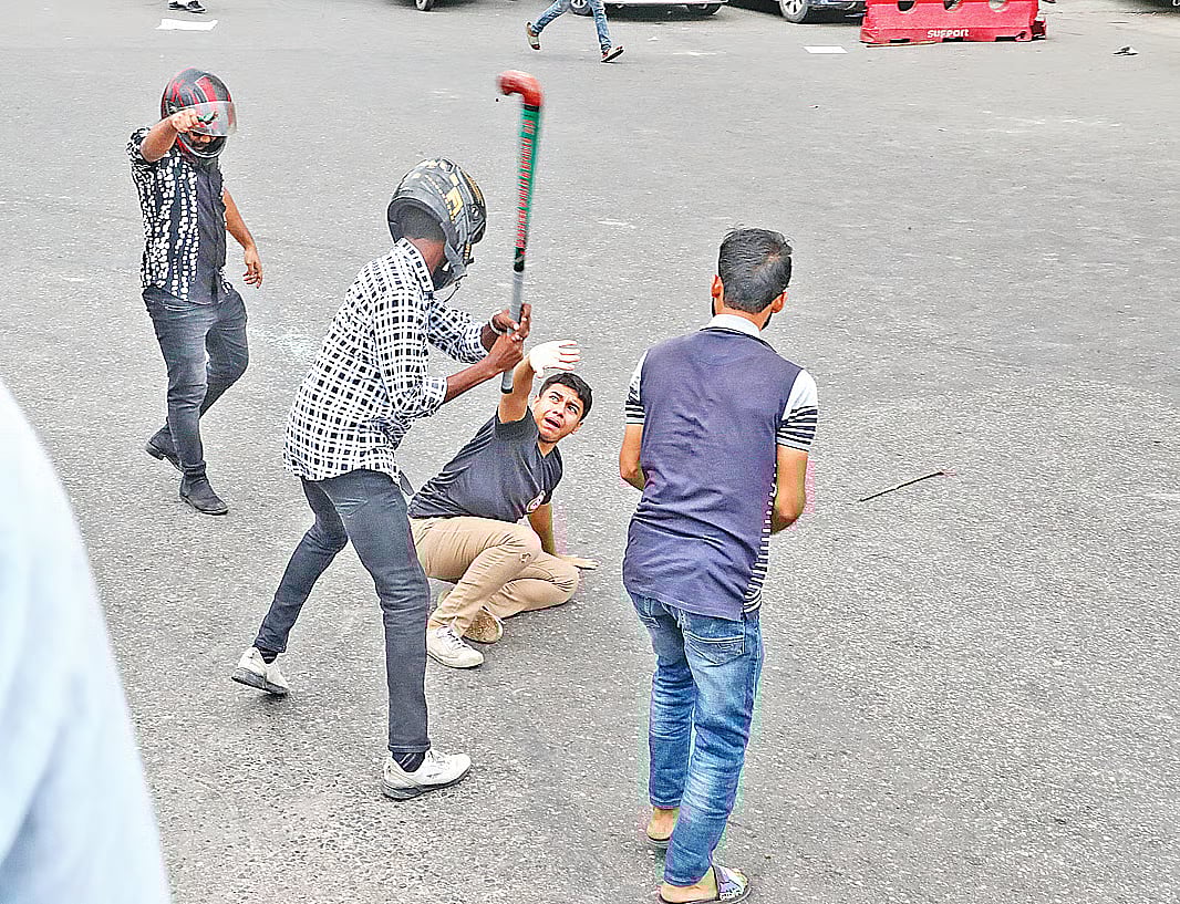 Three persons are beating a protester at Farm Gate, Dhaka on 17 July 2024
