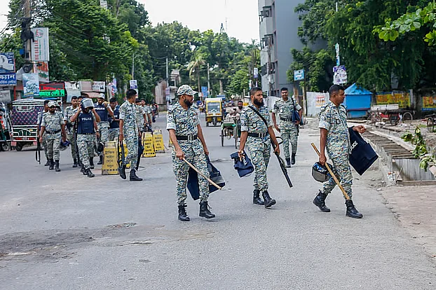 Security forces continue patrolling the streets of Gopalganj in groups as a curfew remains in effect across the city on Friday