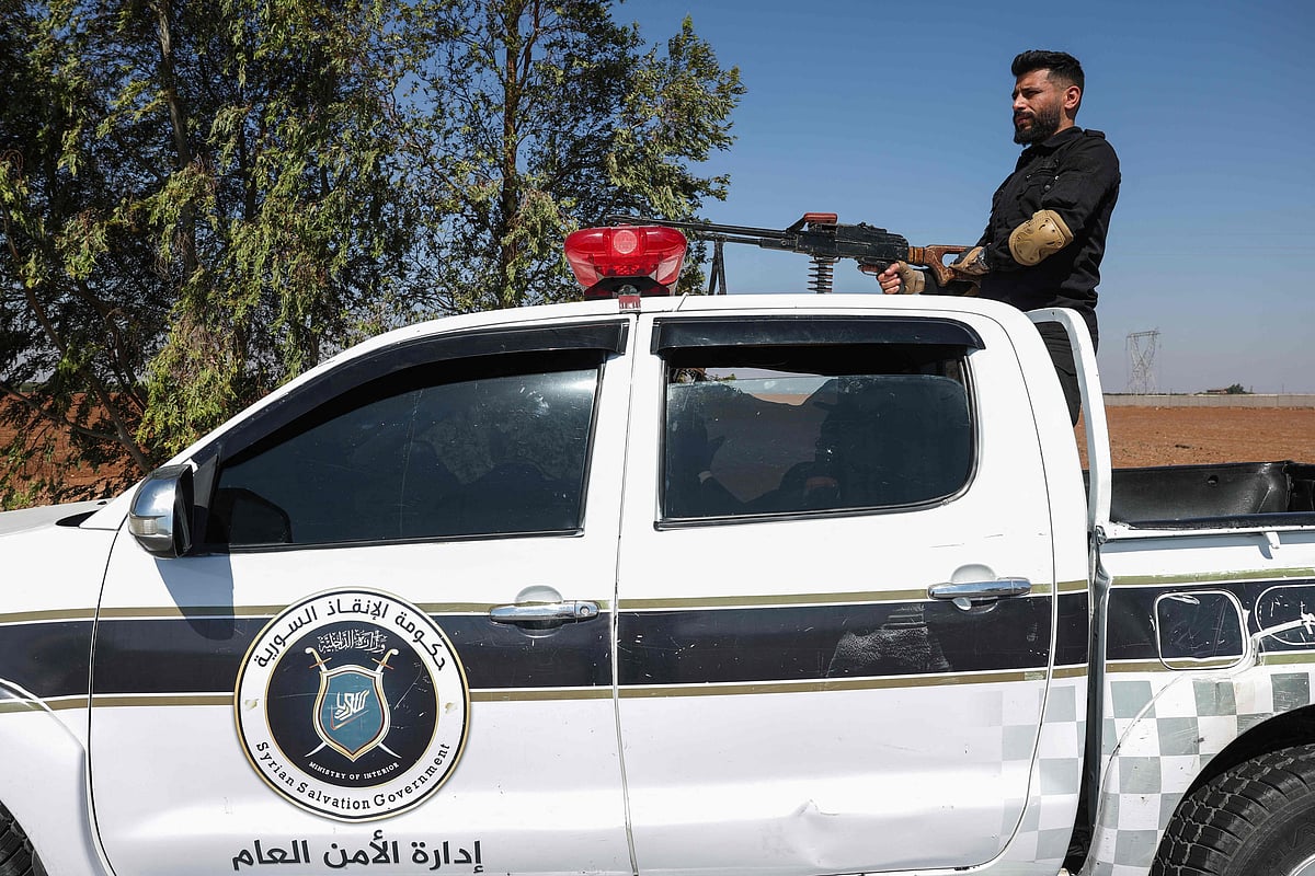 A force of Syria's General Security arrives in Walga town amid clashes between tribal and bedouin fighters on one side, and Druze gunmen on the other, near the predominantly Druze city of Sweida in southern Syria on 19 July, 2025.