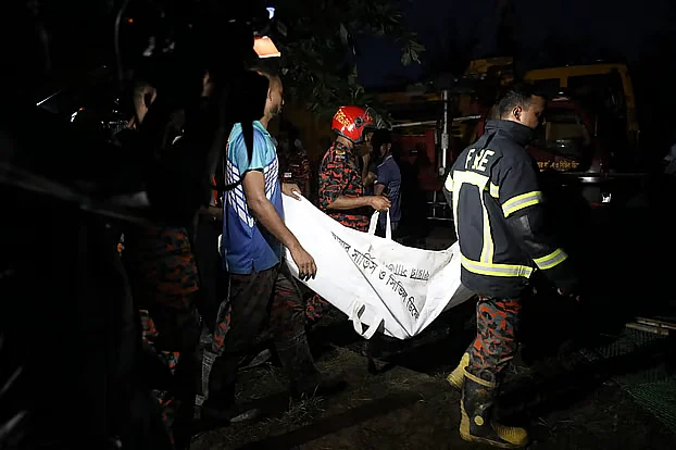 Rescuers recover a body from the scene
