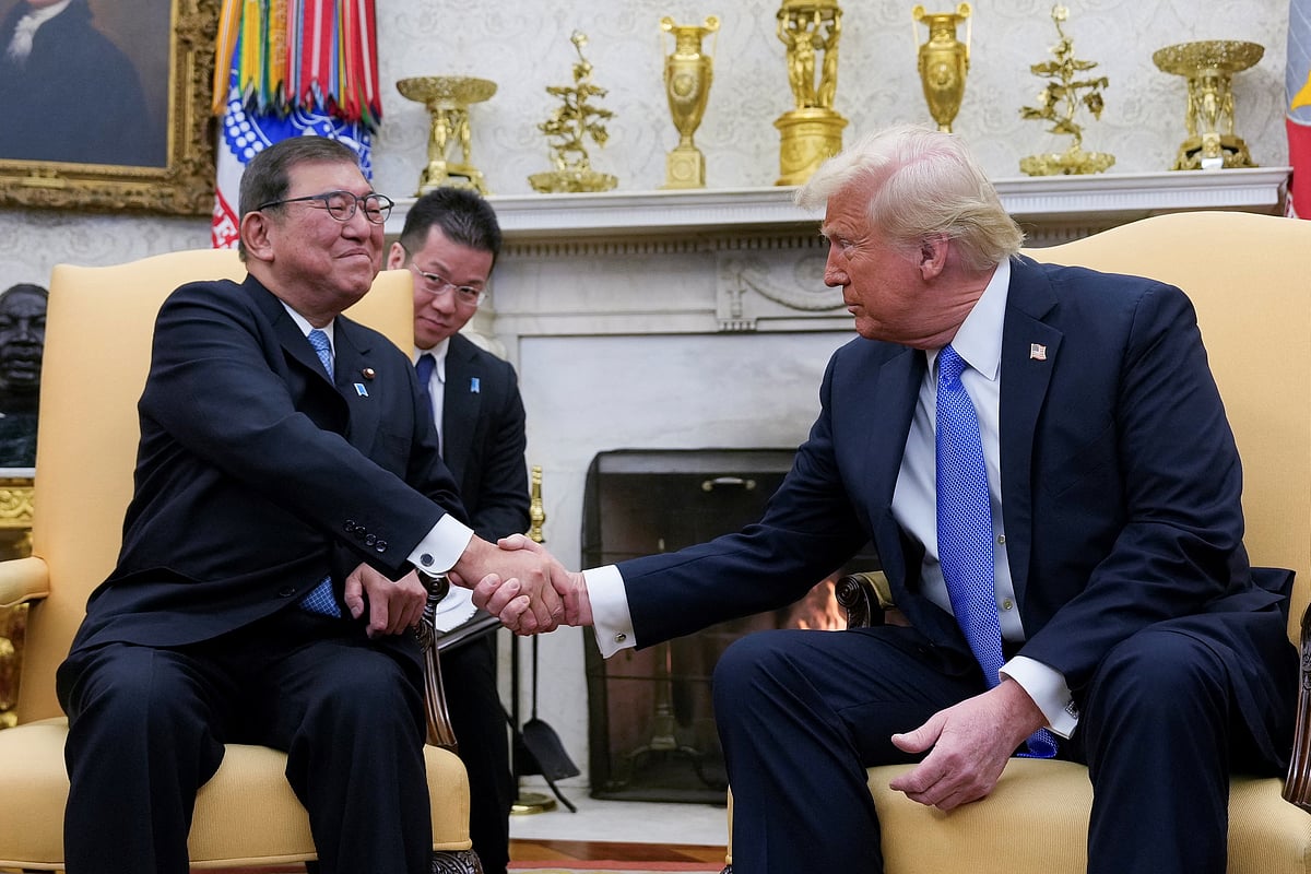 US President Donald Trump shakes hands with Japan's Prime Minister Shigeru Ishiba at the White House in Washington, US, 7 February 2025.