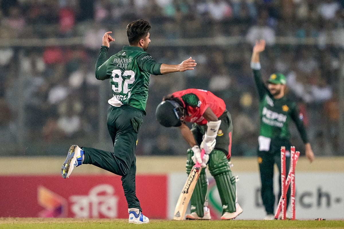 Pakistan's Salman Mirza (L) celebrates after taking the wicket of Bangladesh's Jaker Ali (C) during the third and final Twenty20 international cricket match between Bangladesh and Pakistan at the Sher-e-Bangla National Cricket Stadium in Dhaka on July 24, 2025.