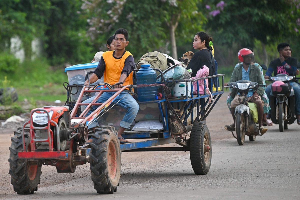 People flee their homes near the border between Cambodia and Thailand in Oddar Meanchey province on 25 July, 2025. Thailand and Cambodia fought their bloodiest military clashes in more than a decade on 24 July, with at least 12 people killed as the two sides battled with tanks, artillery and ground forces over a disputed border zone.