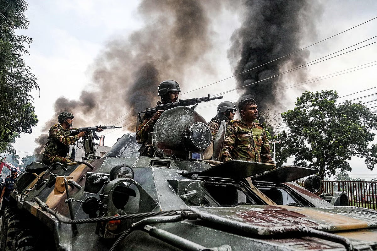 Bangladesh Army members on an armoured vehicle patrolling in Gopalganj on 16 July 2025