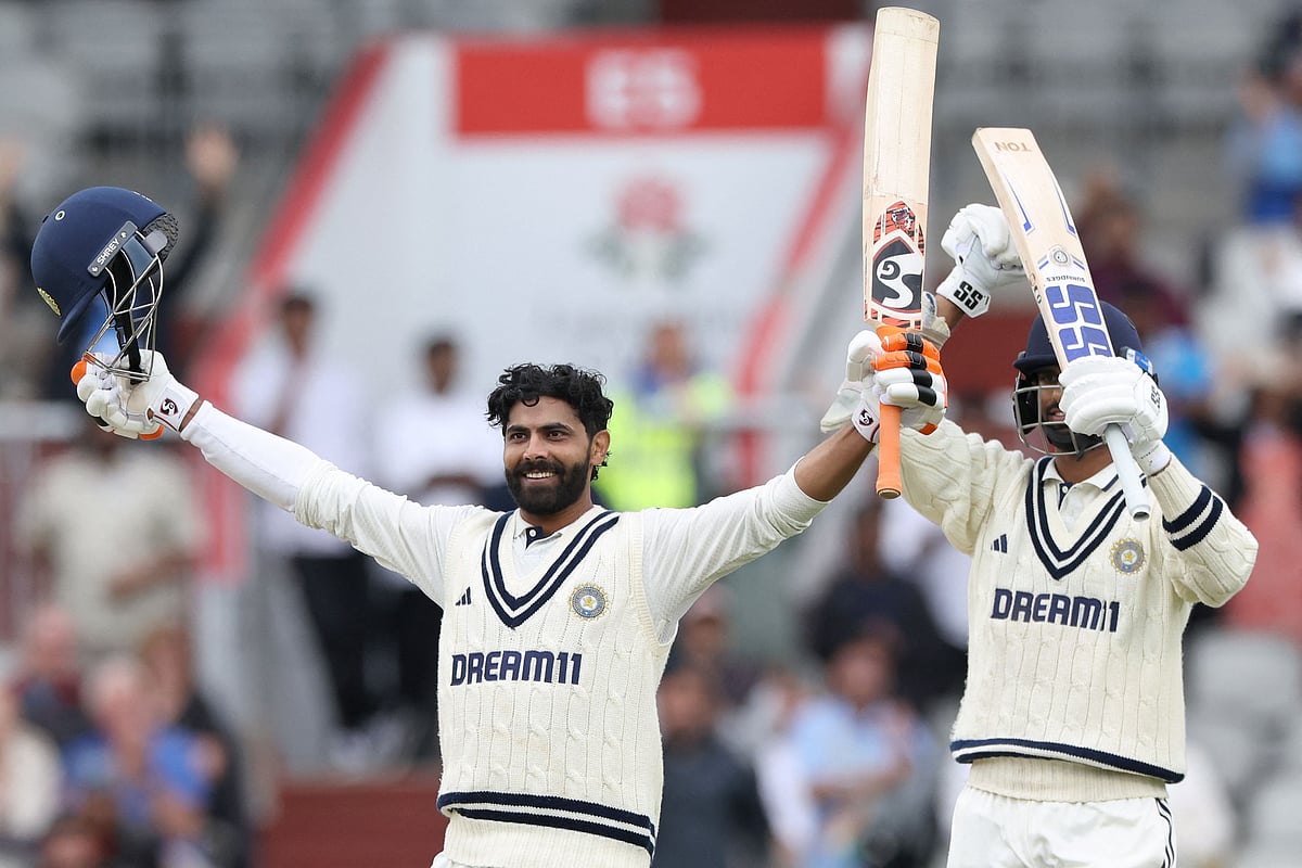 India’s Ravindra Jadeja (L) celebrates after scoring a century (100 runs) on day five of the fourth cricket test match between England and India at Old Trafford, in Manchester, north England, on 27 July 2025