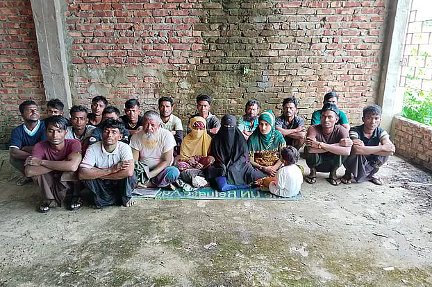 Rohingya refugees who sought shelter on Saint Martin’s Island after being caught in stormy weather at sea