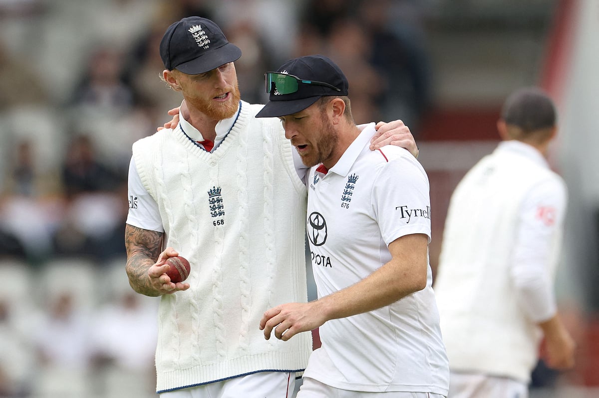 England's captain Ben Stokes (L) talks to England's Liam Dawson (R) on day five of the fourth cricket test match between England and India at Old Trafford, in Manchester, north England, on July 27, 2025