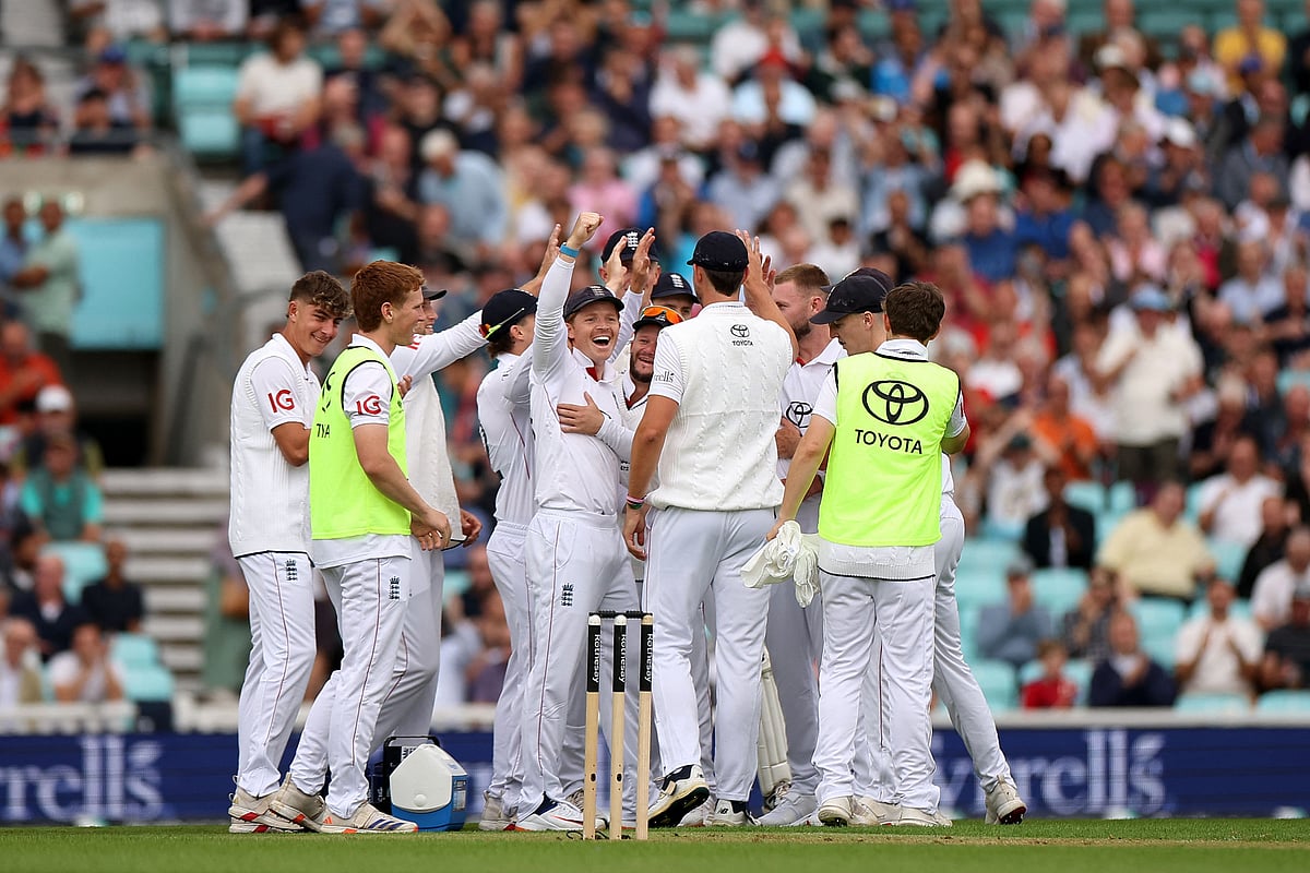 England's Ollie Pope celebrates following a review the first day of the fifth Test cricket match between England and India at The Oval in London on July 31, 2025