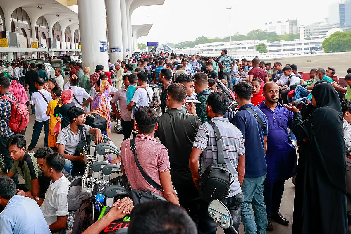 Workers who could not to Malaysia wait at the Dhaka airport in May last year