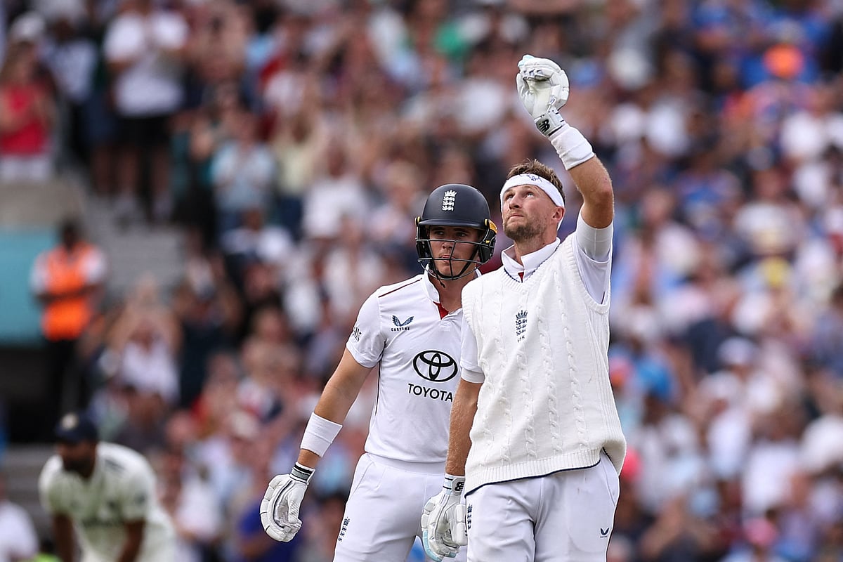 England's Joe Root celebrates getting his 100 on day four of the fifth Test cricket match between England and India at The Oval in London on August 3, 2025