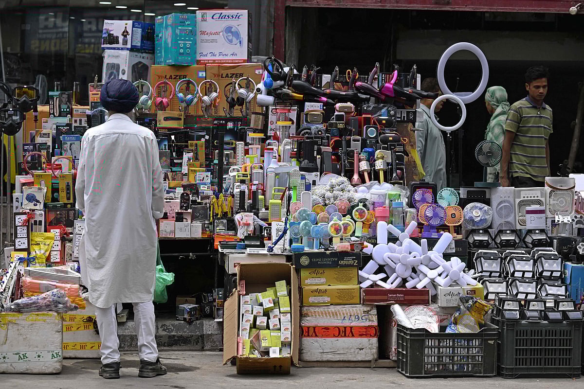 A customer buys electronic items from a roadside shop in Srinagar on 7 August 2025
