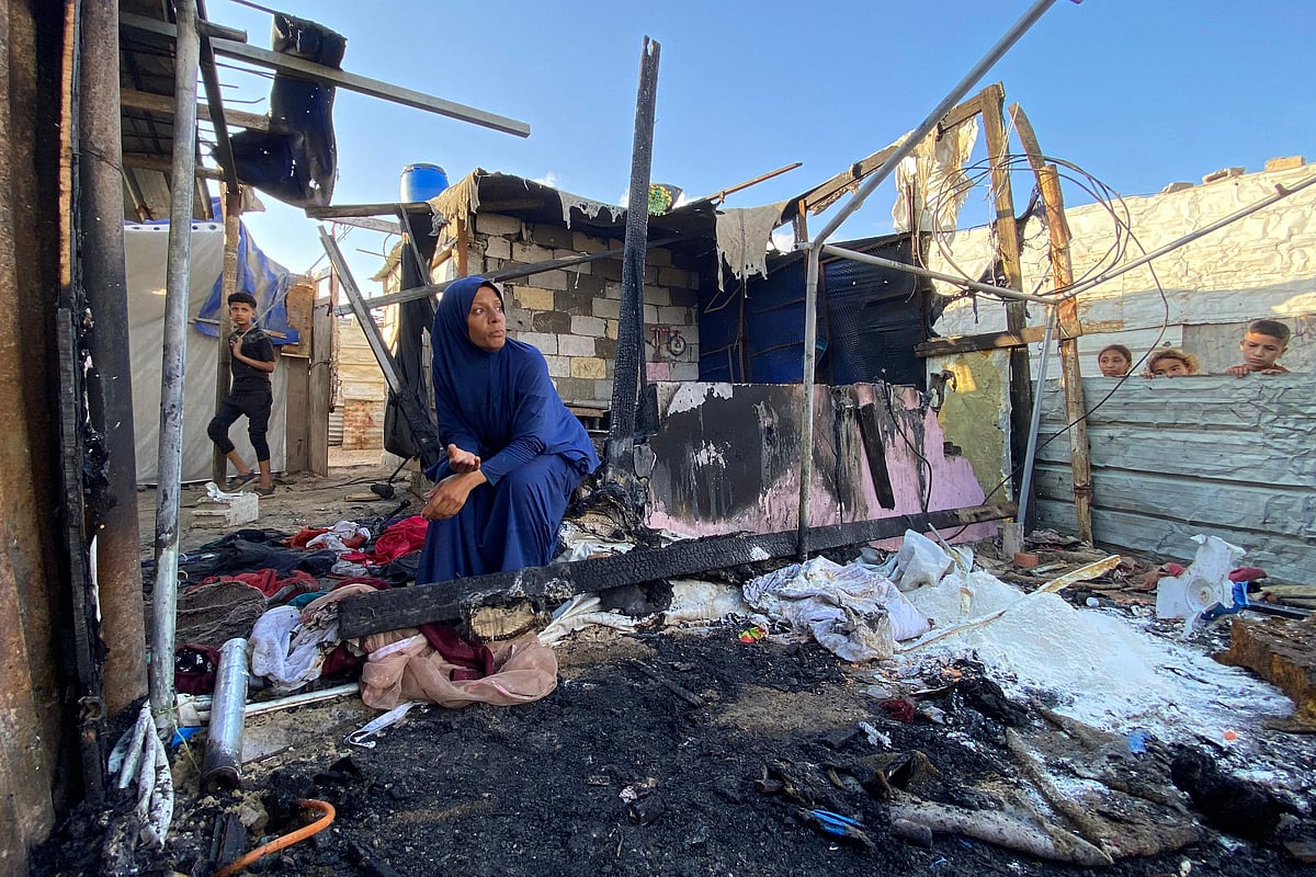 A Palestinian woman reacts at the site of Israeli bombardment on the Mawasi area in Khan Yunis in the southern Gaza Strip on 7 August, 2025.