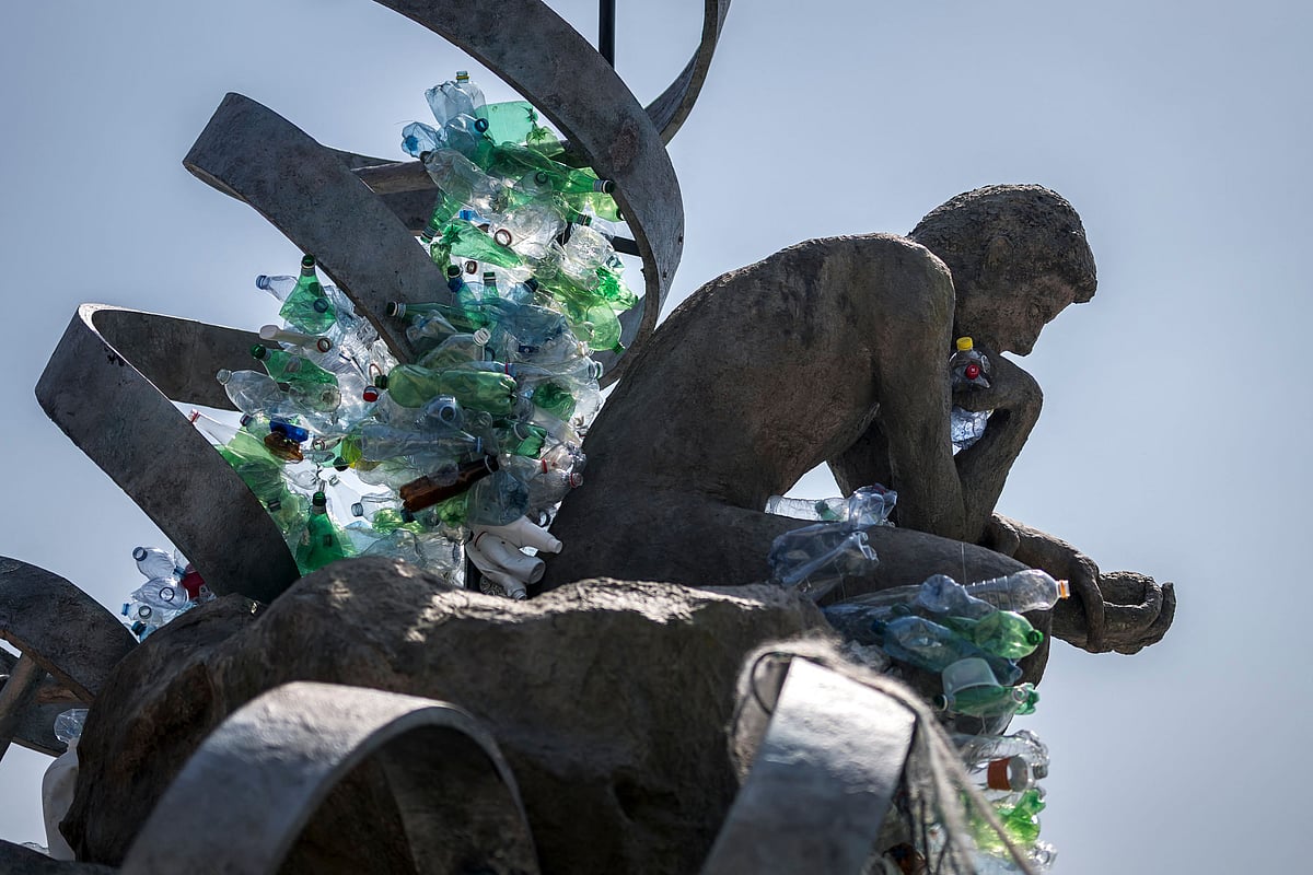 An artwork by Canadian artist, activist, and photographer Benjamin Von Wong entitled "The Thinker's Burden" a 6-meter-tall sculptural remix of Rodin's iconic Thinker, which is being created for the Plastics Treaty Negotiations is seen in front of the United Nations Offices in Geneva on 13 August 2025.
