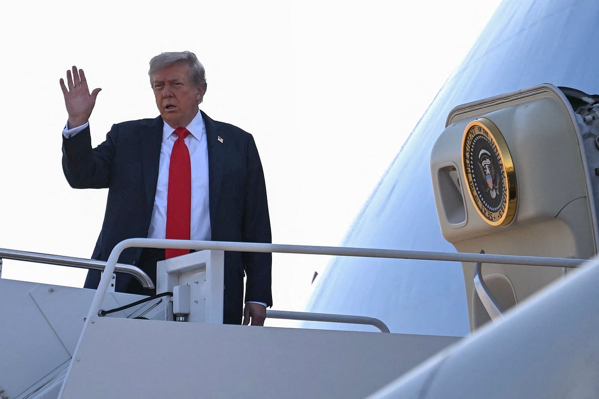 US President Donald Trump waves as he boards Air Force One as he departs Joint Base Andrews in Maryland on 15 August 2025, en route to Anchorage. Trump is headed to Anchorage for a summit with Russian leader Vladimir Putin.