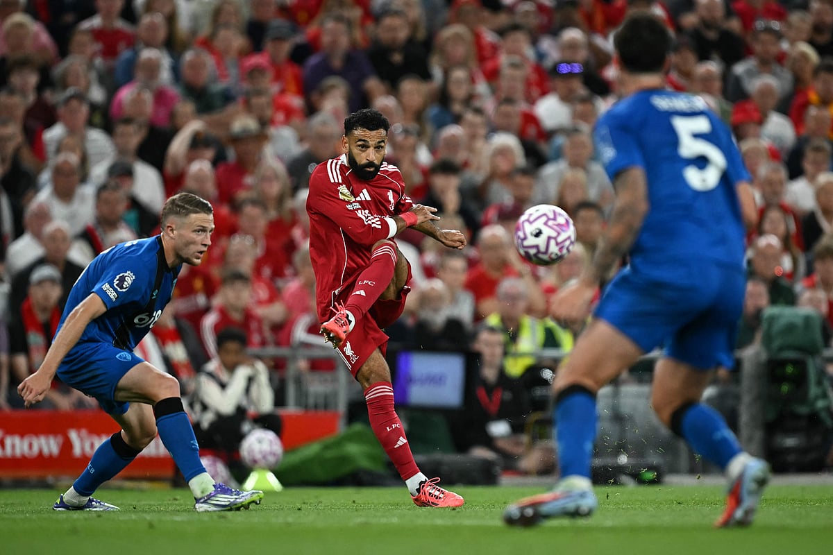 Liverpool's Egyptian striker #11 Mohamed Salah (C) shoots but fails to score during the English Premier League football match between Liverpool and Bournemouth at Anfield in Liverpool, north west England on 15 August, 2025.
