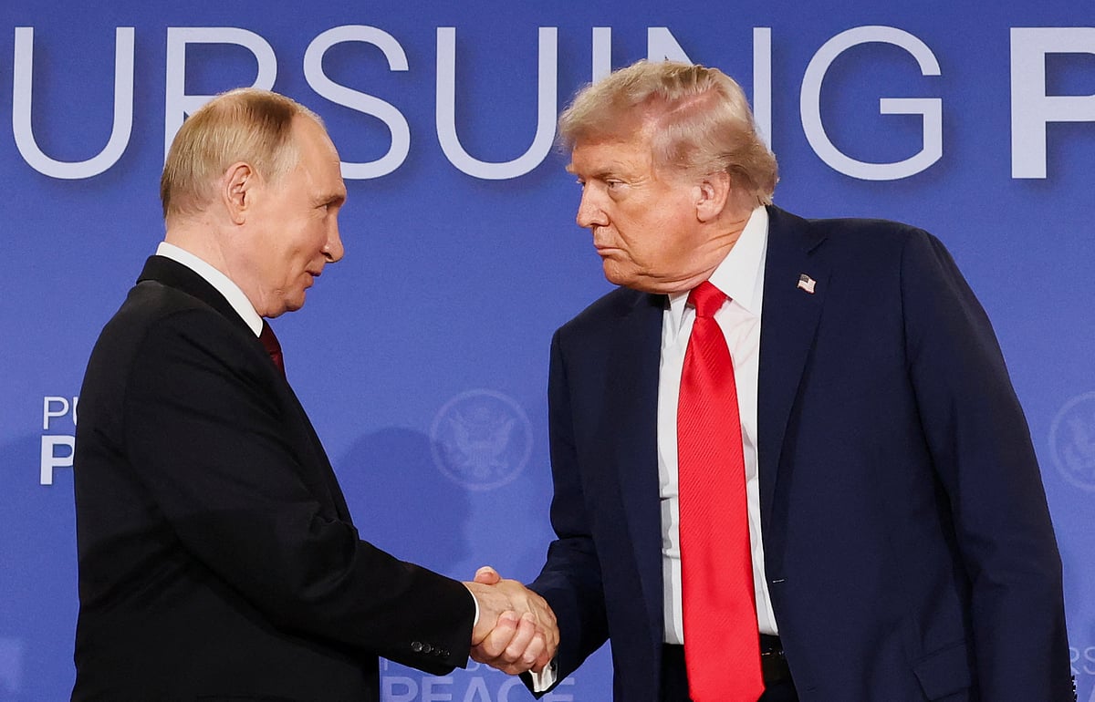 President Donald Trump and Russian President Vladimir Putin shake hands during a press conference following their meeting at Joint Base Elmendorf-Richardson, in Anchorage, Alaska, 15 August 2025.