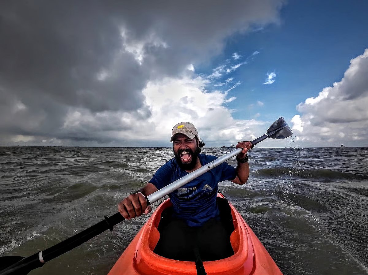 Intiaz Mahmud kayaking against the strong currant.