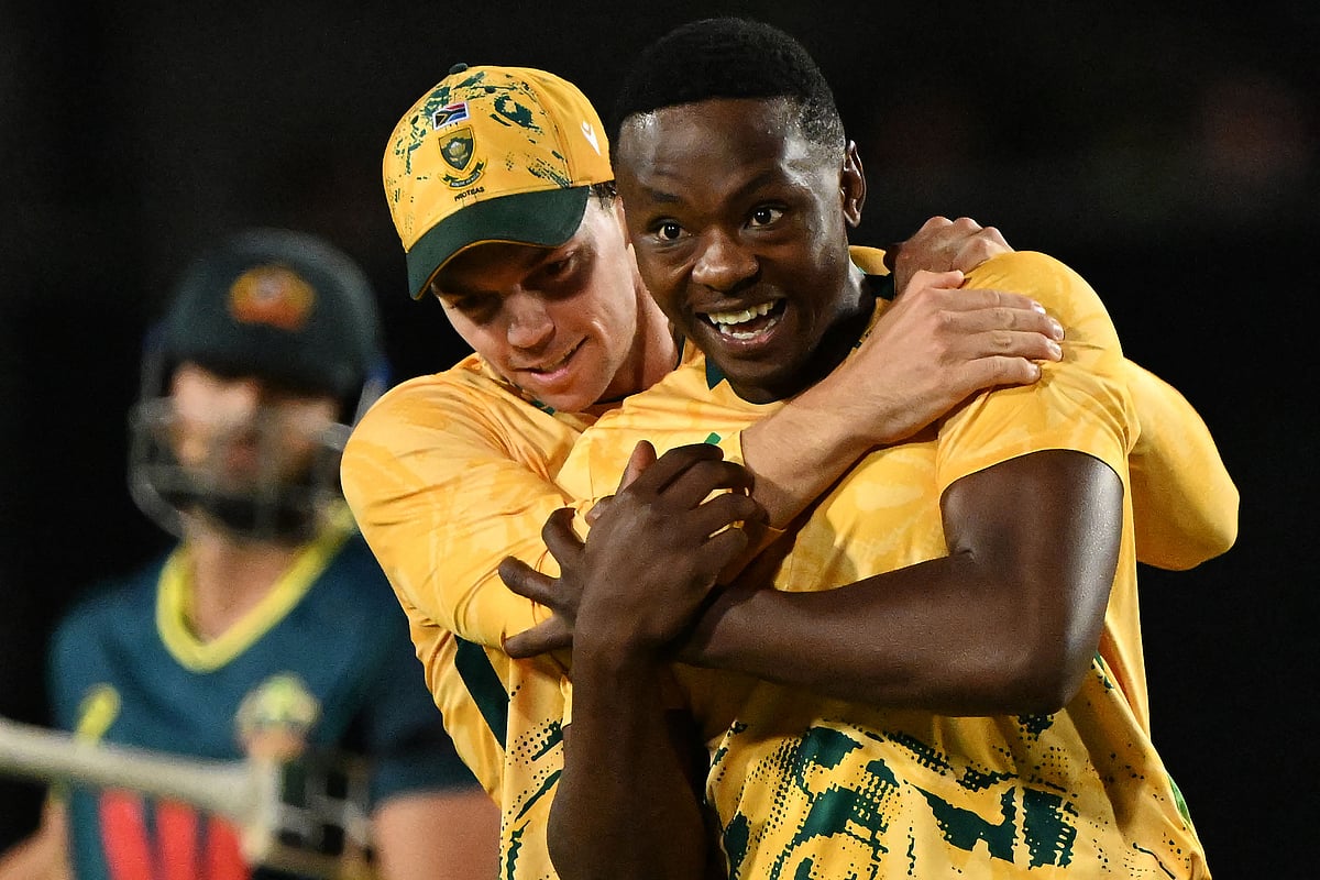 South Africa’s paceman Kagiso Rabada (R) celebrates his wicket of Australia's Tim David with teammates during the third Twenty20 international cricket match between Australia and South Africa in Cairns on 16 August, 2025