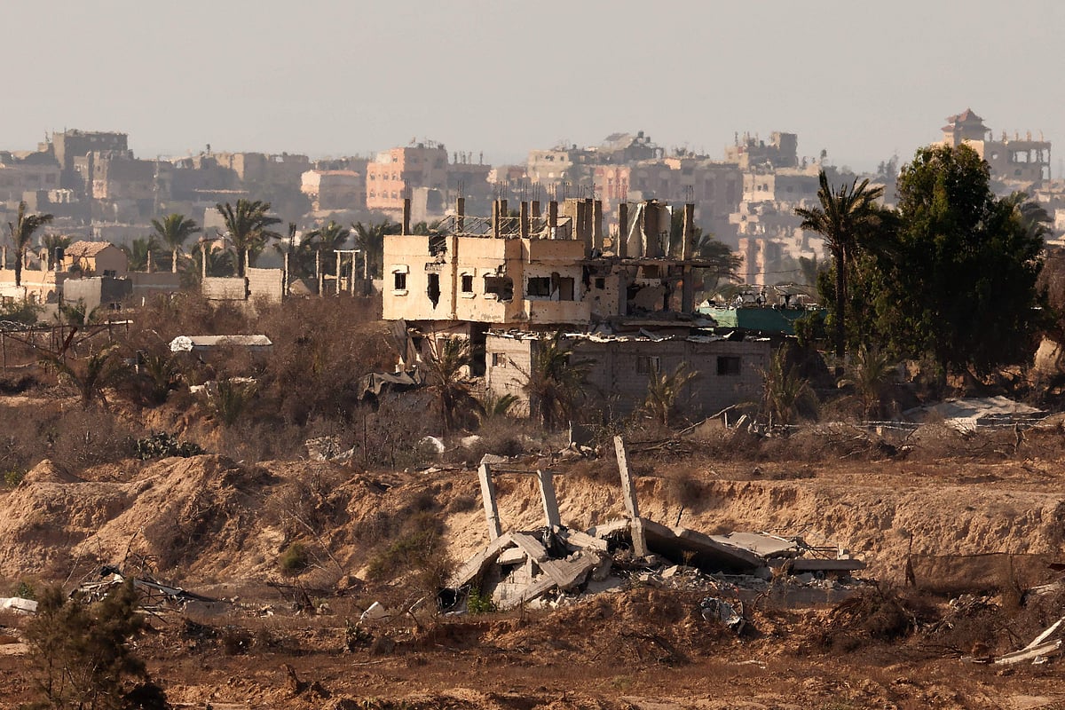 This picture taken from a position on the Israeli border with the Gaza Strip, shows destroyed buildings in the besieged Palestinian territory on August 21, 2025