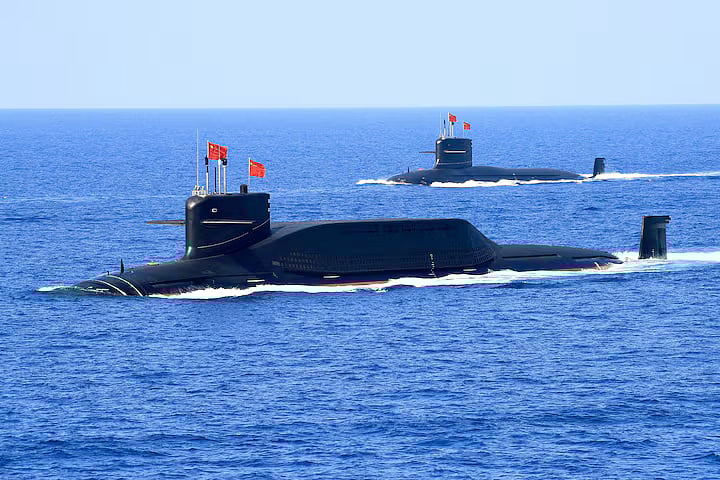A nuclear-powered Type 094A Jin-class ballistic missile submarine of the Chinese People's Liberation Army (PLA) Navy navigates during a military display in the South China Sea, 12 April, 2018.