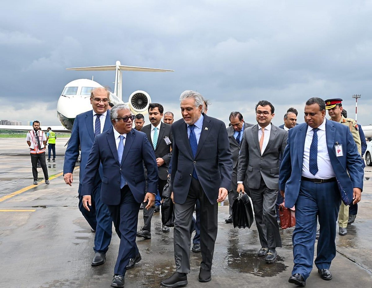 Bangladesh’s foreign secretary Asad Alam Siam receives Pakistan's deputy prime minister Ishaq Dar at Hazrat Shahjalal International Airport on 23 August