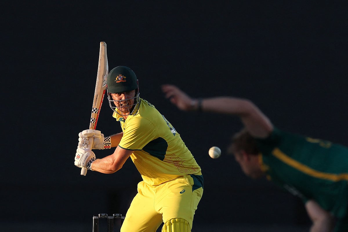 Australia’s Cameron Green (L) watches a delivery from the bowling of South Africa’s Corbin Bosch (R) during the third one-day international cricket match between Australia and South Africa at the Great Barrier Reef Arena in Mackay on August 24, 2025
