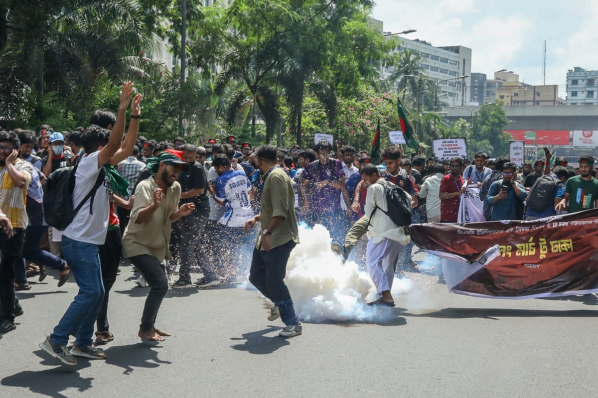 Police fire sound grenades to disperse the crowd.