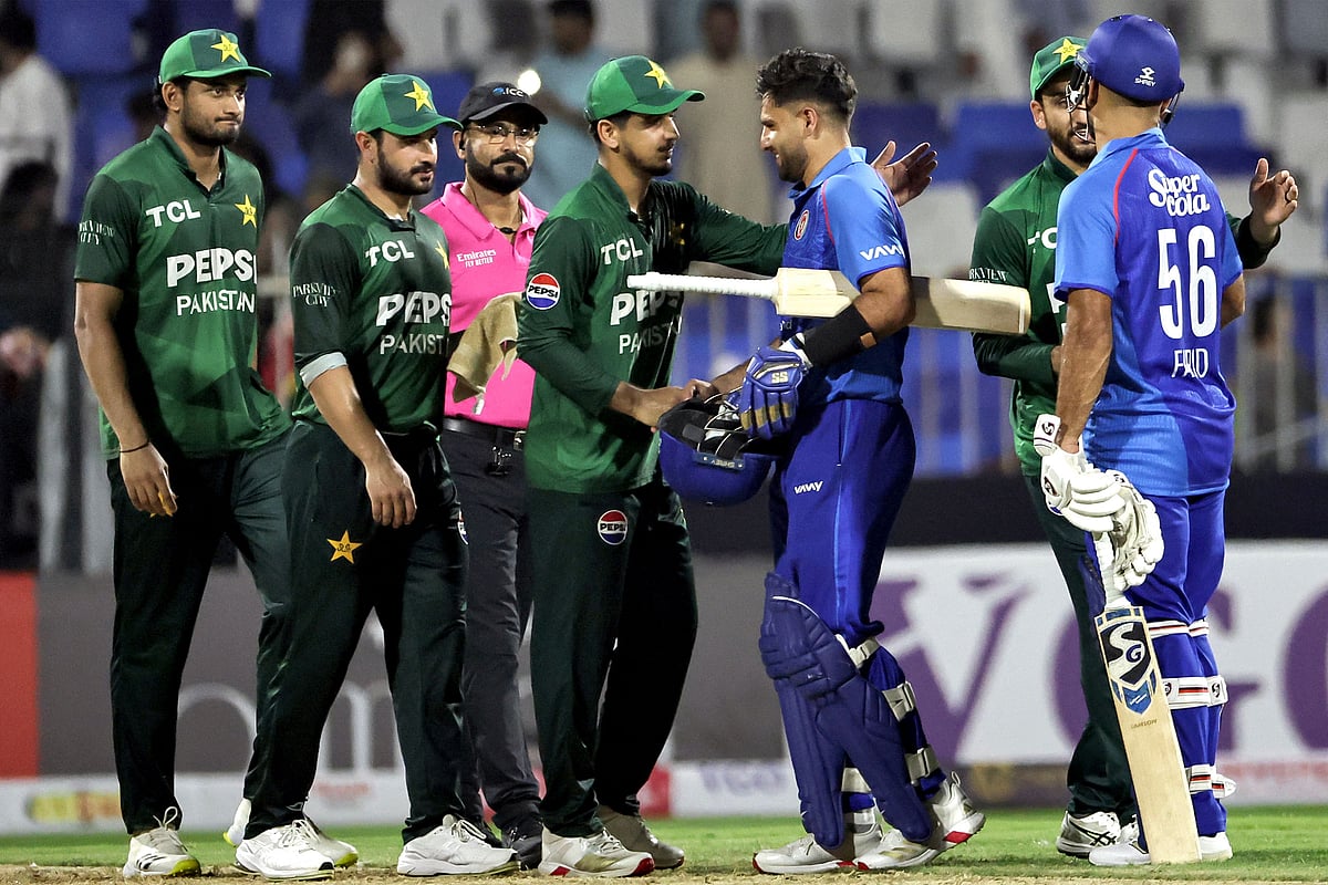 Pakistan and Afghanistan's players shake hands at the end of their UAE Tri-Series match in Sharjah on 29 August 2025.