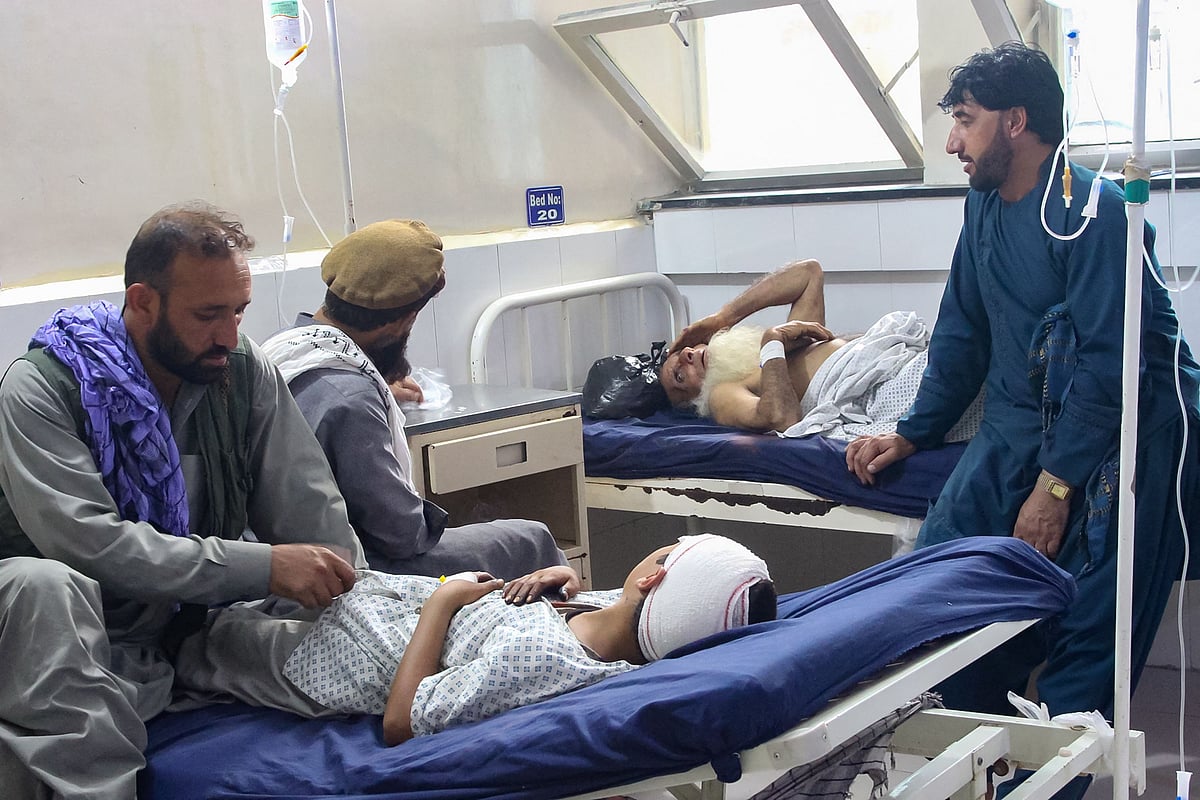 Injured Afghan people receive treatment at a hospital after an earthquake in Afghanistan's Jalalabad on September 1, 2025.