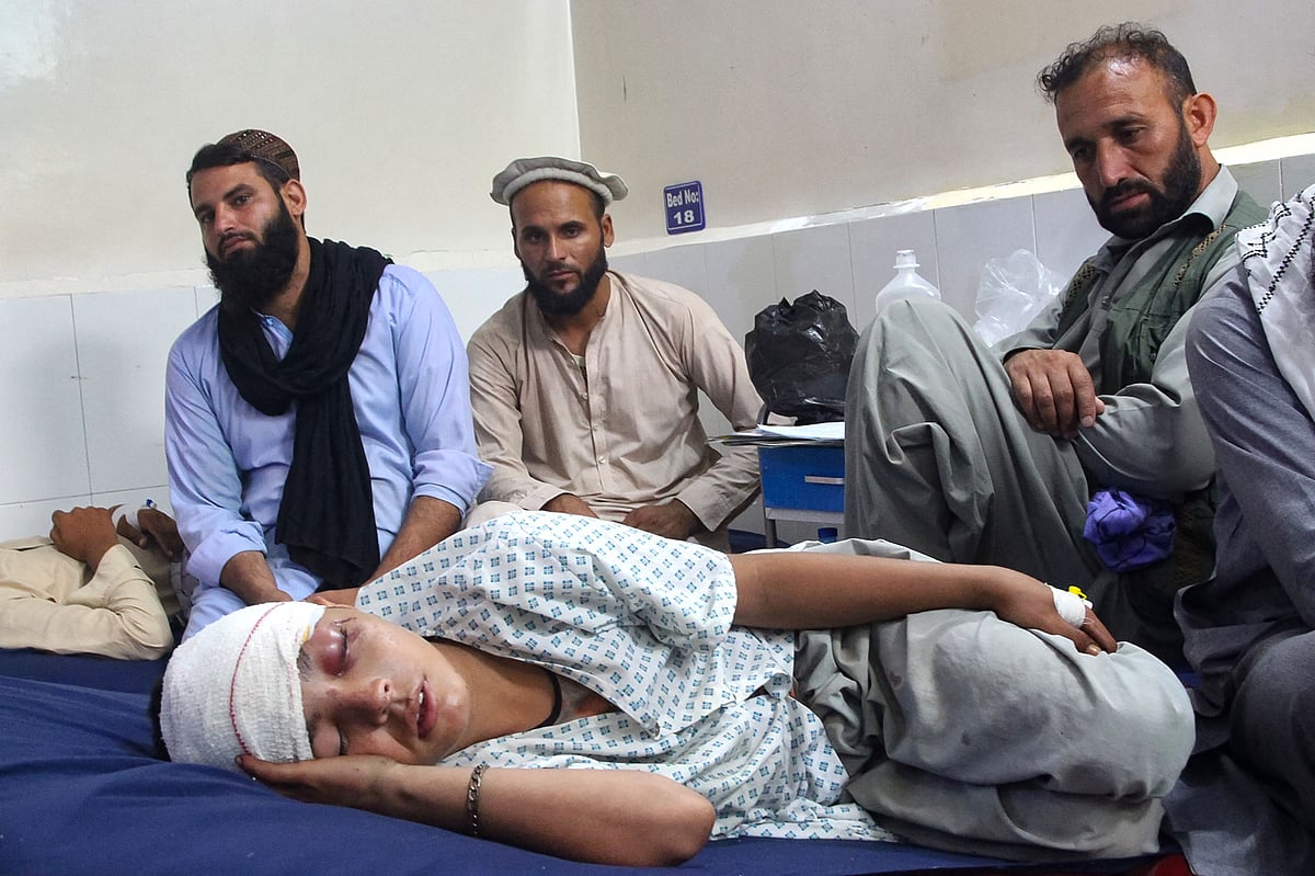 An injured Afghan boy (bottom) receives treatment at a hospital after an earthquake in Afghanistan's Jalalabad on September 1, 2025