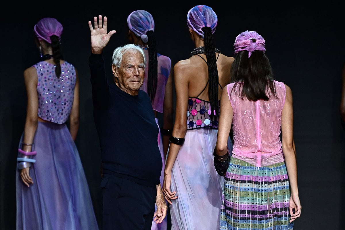 Italian designer Giorgio Armani waves from the runway of the Emporio Armani fashion show during the Milan Fashion Week Womenswear Spring/Summer 2024 on 21 September, 2023 in Milan.