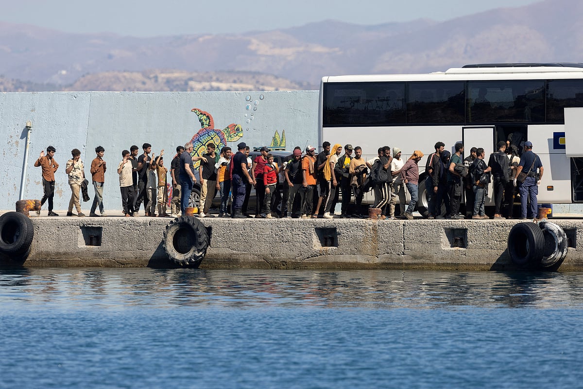 Migrants board a bus, after Greece rescued hundreds of migrants off the islands of Gavdos and Crete in separate incidents, according to the Greek Coast Guard, in the port of Agia Galini, Greece on 6 July 2025.