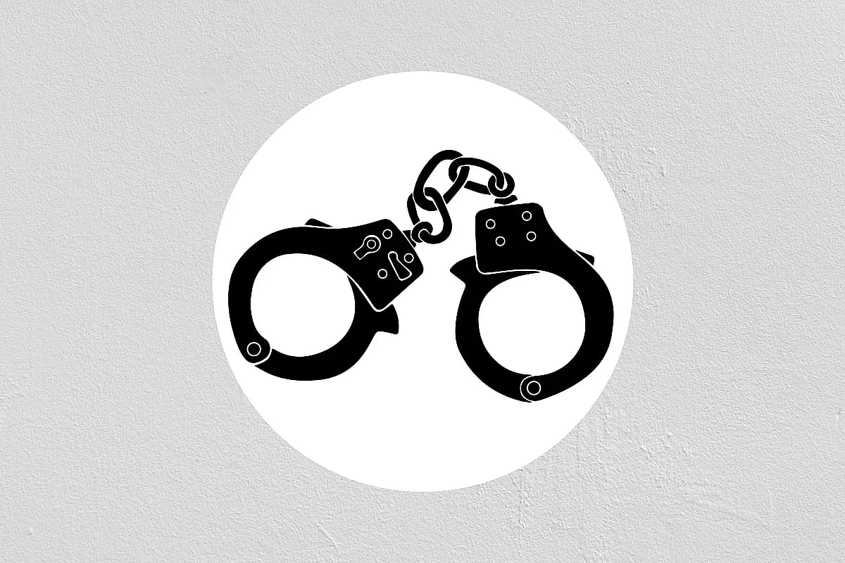 Photo shows a pair of handcuff.