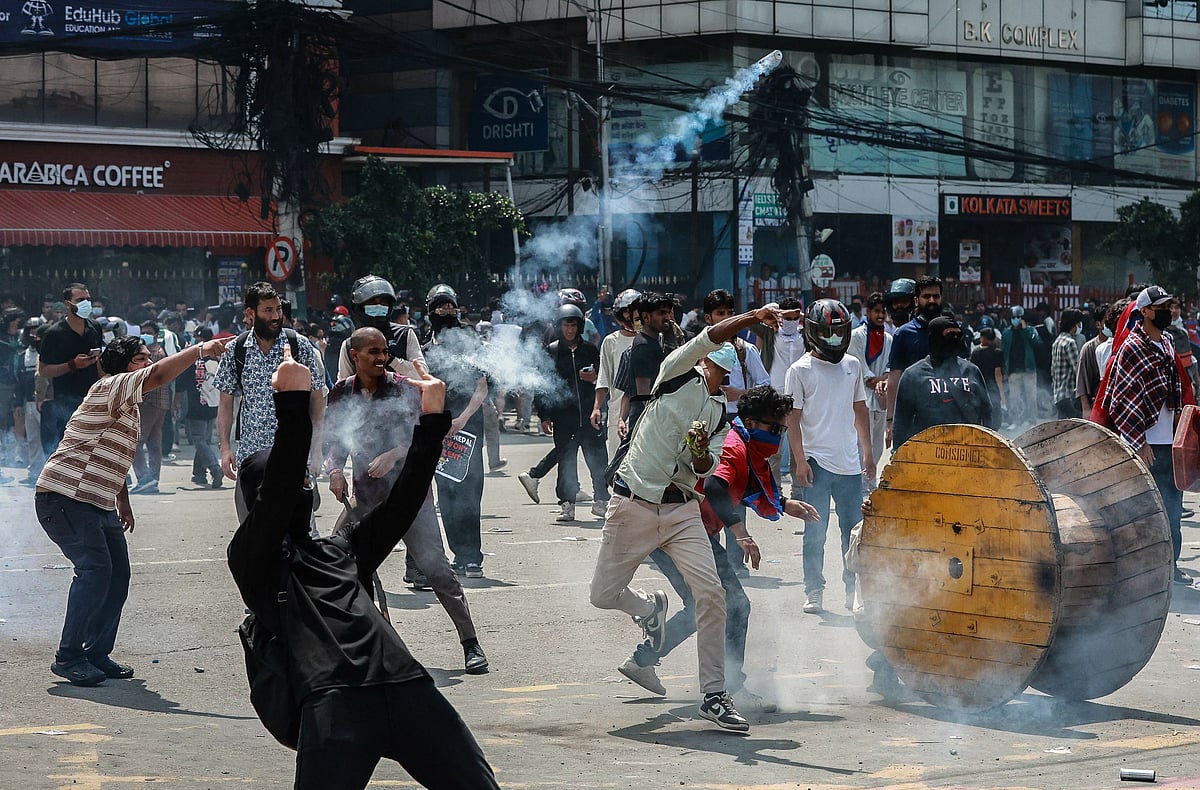 Demonstrators clash with riot police personnel during a protest outside the Parliament in Kathmandu on 8 September 2025, condemning social media prohibitions and corruption by the government