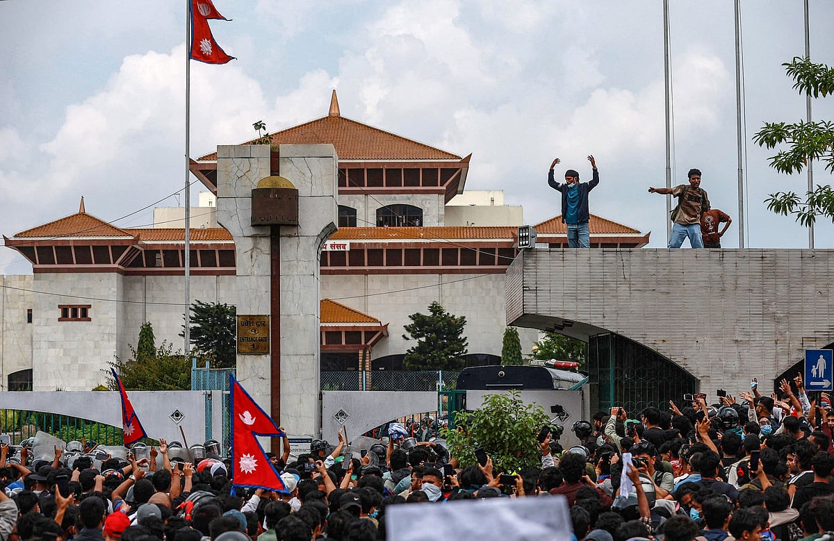 Demonstrators gather outside Nepal's Parliament during a protest in Kathmandu on 8 September 2025, condemning social media prohibitions and corruption by the government.