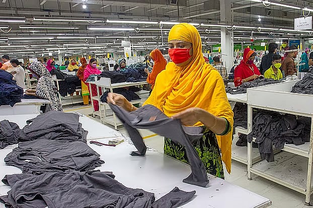 Workers work at a readymade garments factory.